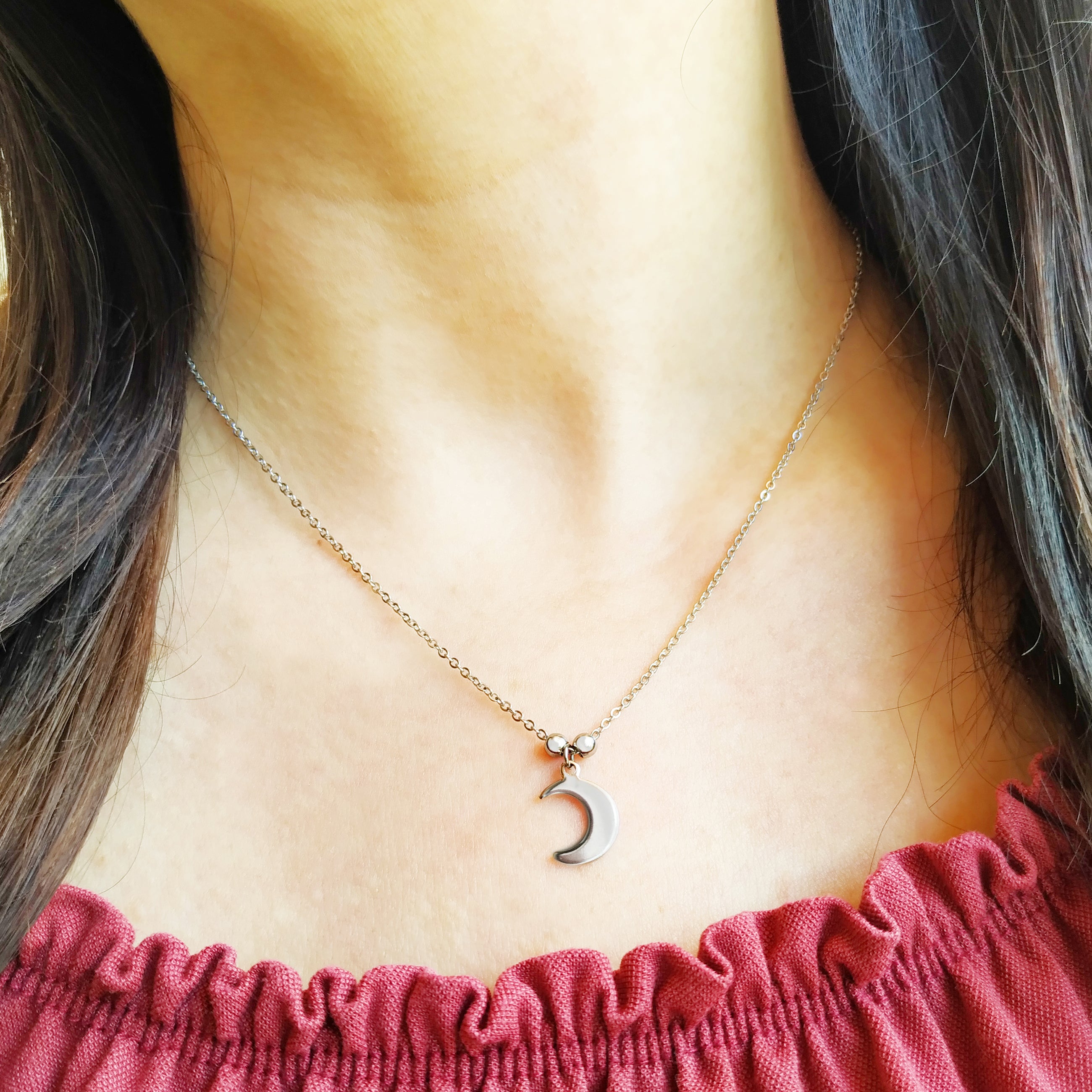 Collana Spicchio di Luna in acciaio inox