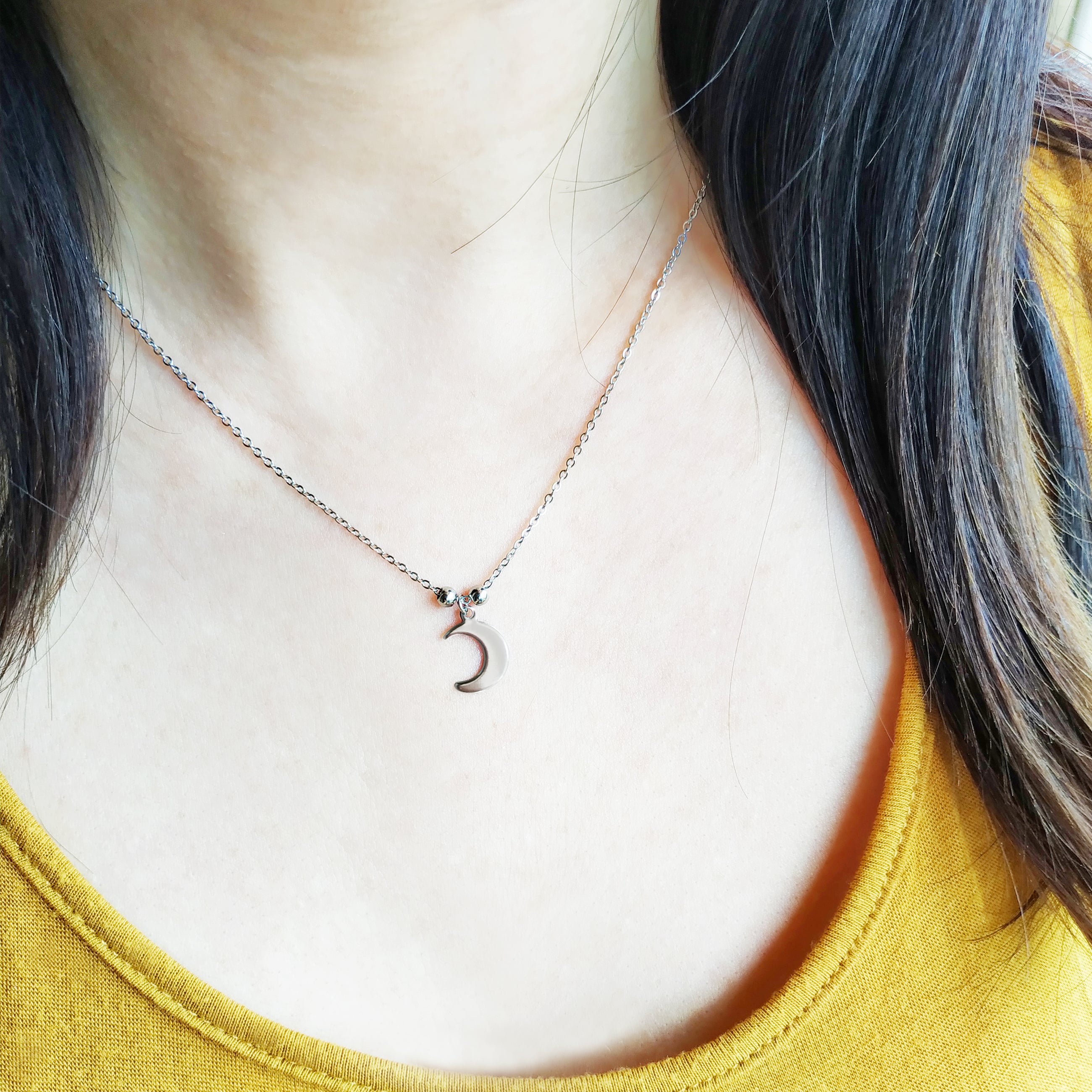 Collana Spicchio di Luna in acciaio inox